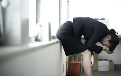 stressed businesswoman at office