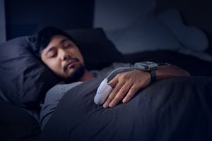 Man Wearing a Pulse Oximeter - At Home Sleep Study Test for Sleep Apnea