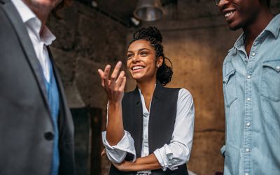 businesswoman speaking with colleagues