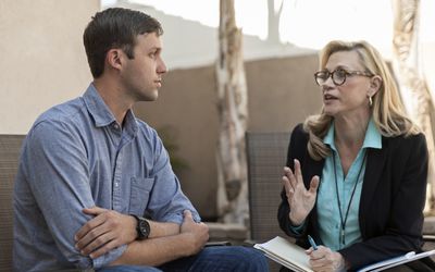 man talking to therapist in therapy