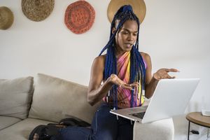 African American transgender woman in video call of online psychotherapy. 