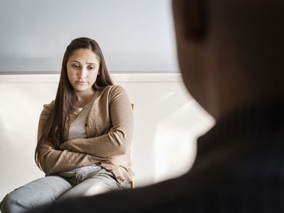 Student and psychologist talking in office