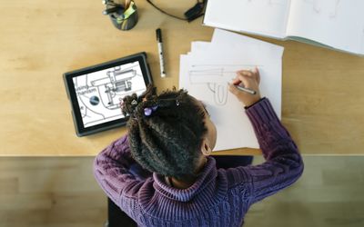 Child working on an invention