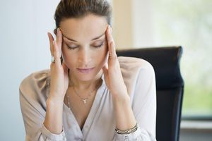 Close-up of a businesswoman suffering from caffeine withdrawal syndrome