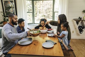 Family eating dinner together at home