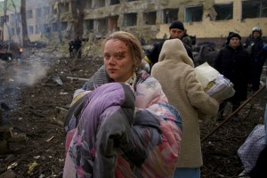 Marianna Vishegirskaya stands outside a maternity hospital that was damaged by shelling in Mariupol, Ukraine, Wednesday, March 9, 2022. (AP Photo/Mstyslav Chernov, File)