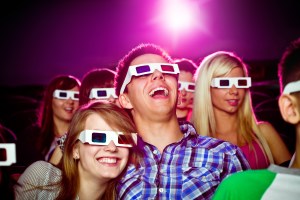 People in a cinema wearing 3D goggles