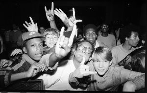 A photo of a crowd of youths at a rap show in the 80s.