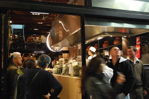 Dinner queue at Sydney restaurant at night. Flights to Sydney experiences