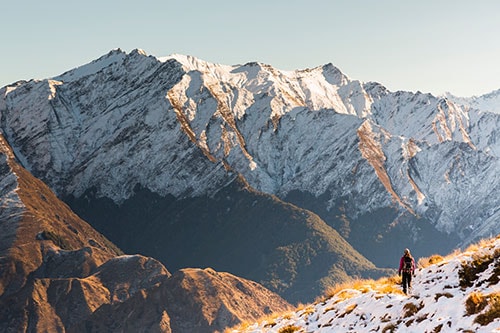 Hiker walking the Moonlight Track near Queenstown.