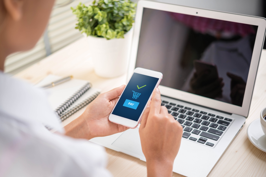 credit card register and credit card being tended at counter. Photo by Clay Banks on Unsplash