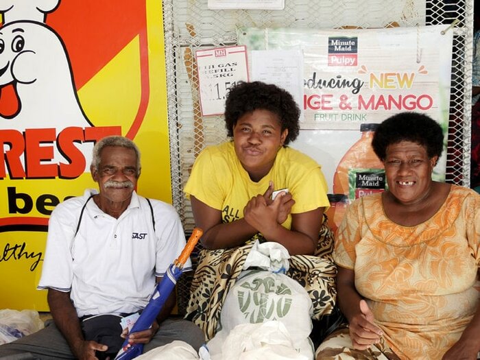 Man, wife, and their daughter with their nutritious food ration, supported by WFP