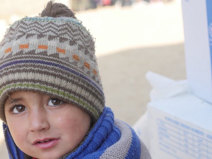 Child in WFP's food assistance distribution center in Syria