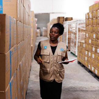 Priscilla Muchira, WFP Storekeeper, performs a stock check in the Kilindini warehouse in Mombasa, Kenya, on September 21, 2023. 