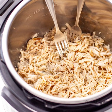 Instant Pot chicken breast shredded in the pot.