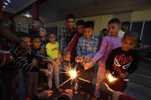 Children play with firecrackers on Diwali festival, the Hindu festival of lights, at an orphanage in Jammu, India, Thursday, Oct.31, 2024. (AP Photo/Channi Anand)