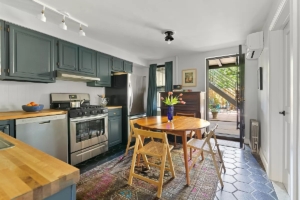 kitchen and door to back patio in Park Slope studio - Park Slope apartments