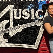 Gabriel Luna standing next to a South Austin Music sign (Credit: Entertainment 360) thumbnail