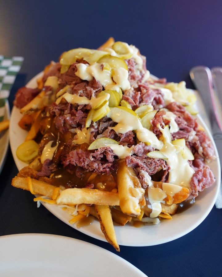 Smoked meat is another quintessential Montreal food; even more delicious when topping a platter of piping hot poutine (Credit: Getty Images)