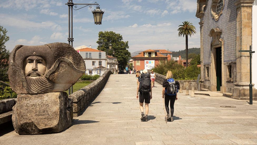 Two female hikers on the Camino Portugués at Ponte de Lima (Credit: Alamy)