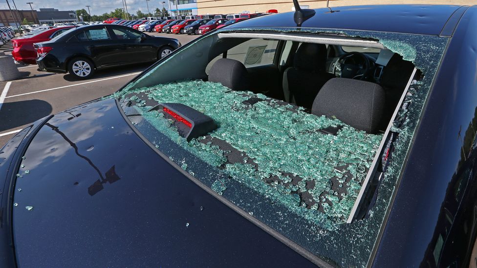 A rear window shattered by hail in a severe storm (Credit: Getty Images)