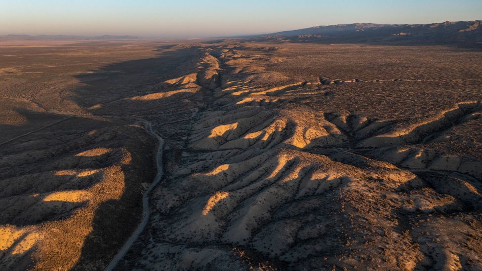 The San Andreas fault between the Pacific and North American tectonic plates is clearly visible from the air in places (Credit: Getty Images)