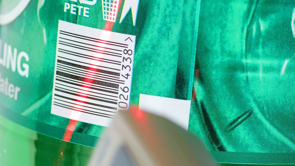 A laser scanner on a barcode on a bottle of water (Credit: Alamy)