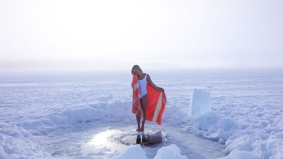 Ice swimmer Elina Mäkinen in an ice hole in Finland (Credit: Taneli Kantanen)